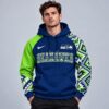 Seattle Seahawks NFL Aztec Inspired Colorblock Hoodie With Asymmetric Sleeves And Bold Team Lettering, NFL Trending Shirt